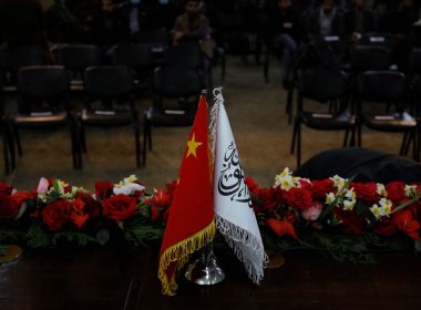 The flags of the China and the Islamic Emirate of Afghanistan are displayed during a news conference held by Afghan Deputy Prime Minister Mullah Abdul Ghani Baradar and Wang Yu, China's ambassador in Afghanistan, in Kabul, Afghanistan, January 5, 2023. REUTERS/Ali Khara/File photo