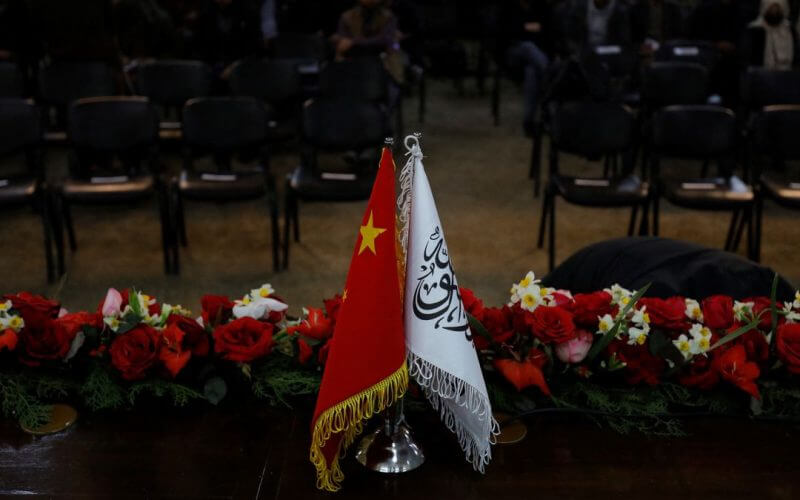 The flags of the China and the Islamic Emirate of Afghanistan are displayed during a news conference held by Afghan Deputy Prime Minister Mullah Abdul Ghani Baradar and Wang Yu, China's ambassador in Afghanistan, in Kabul, Afghanistan, January 5, 2023. REUTERS/Ali Khara/File photo