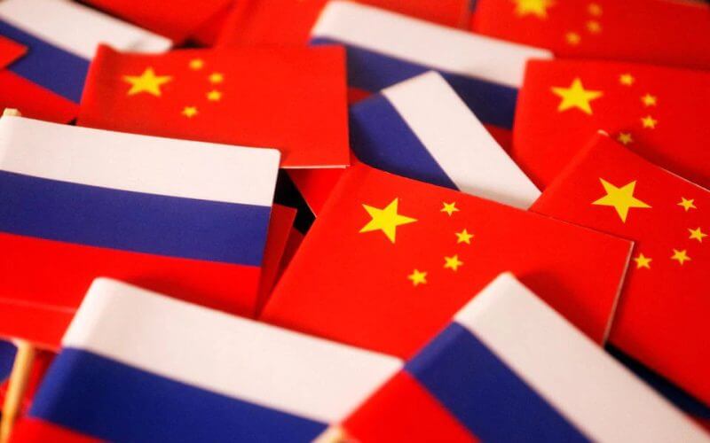 Flags of China and Russia are displayed in this illustration picture taken March 24, 2022. REUTERS