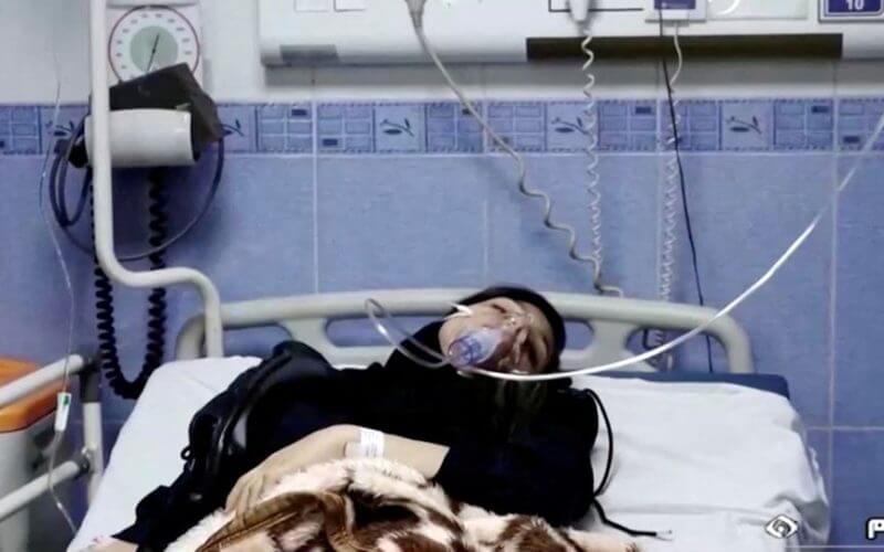 A young woman lies in hospital after reports of poisoning at an unspecified location in Iran in this still image from video from March 2, 2023. WANA/Reuters TV via REUTERS