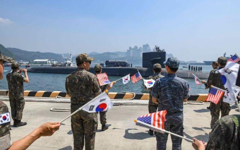 South Korea Navy sailors celebrate the arrival of the Ohio-class guided-missile submarine USS Michigan (SSGN 727) in Busan. Photo courtesy of Michael Chen/U.S. Navy