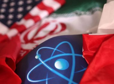 Atomic symbol and USA and Iranian flags are seen in this illustration taken, September 8, 2022. REUTERS