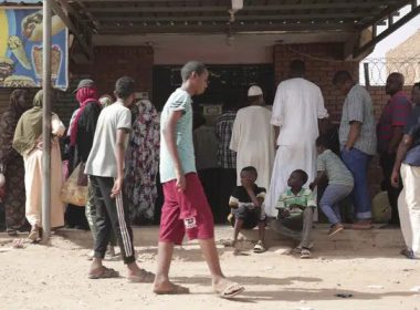 People line up in front of a bakery during a cease-fire in Khartoum, Sudan, Saturday, May 27, 2023. Saudi Arabia and the United States say the warring parties in Sudan are adhering better to a week-long cease-fire after days of fighting. (AP Photo/Marwan Ali)