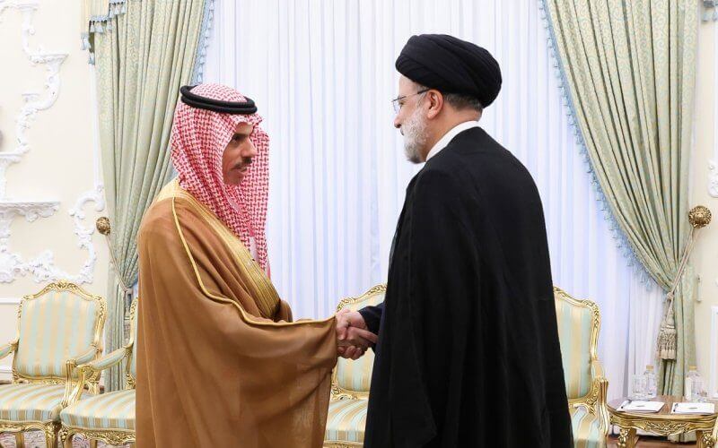 A handout photo made available by the Iranian Presidency shows Iranian President Ebrahim Raisi (R) greeting Saudi Foreign Minister Feisal Bin Farhan (L) during a meeting in Tehran on Saturday. Photo by EPA-EFE