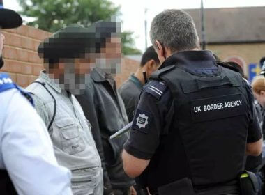 Illegal immigrants with members of the UK Border Agency. walesonline.co.uk