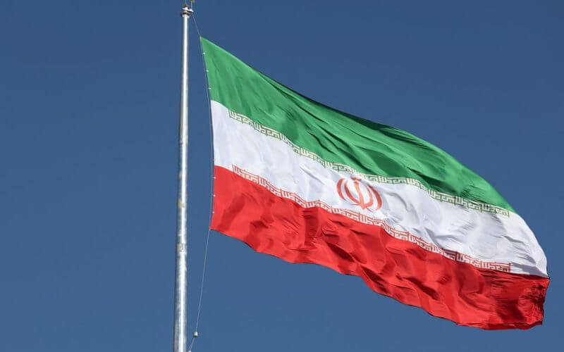 The Iranian flag is seen flying over a street in Tehran, Iran, February 3, 2023. Majid Asgaripour/WANA (West Asia News Agency) via REUTERS