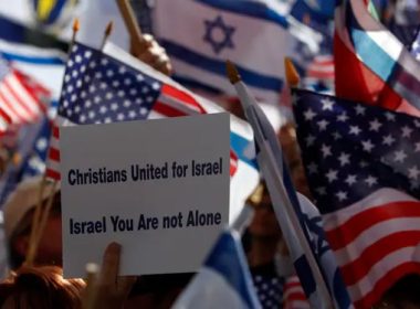 Christian demonstrators, members of "Christians United for Israel" organization, carry flags during a march to show solidarity with Israel, in Jerusalem April 7, 2008. Eliana Aponte/Reuters.