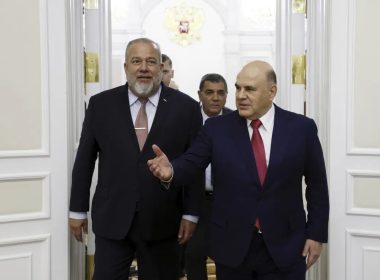 Russian Prime Minister Mikhail Mishustin, right, and Cuba's Prime Minister Manuel Marrero Cruz enter a hall for their talks in Moscow, Russia, Tuesday, June 13, 2023. (Dmitry Astakhov, Sputnik, Government Pool Photo via AP)