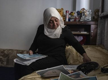 Hamrin Alouji, the mother of 13-year-old Peyal Aqil, goes through her daughter’s photographs at their family home in Qamishli, Syria, on Monday, June 5, 2023. (AP Photo/Baderkhan Ahmad)