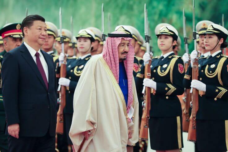 Chinese president Xi Jinping accompanies Saudi Arabia's king Salman bin Abdulaziz Al Saud listen to their national anthems during a welcoming ceremony inside the Great Hall of the People on March 16, 2017 in Beijing, China. / Getty Images