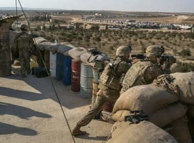 American Special Forces soldiers scan the area at a front line outpost outside the northern Syrian city of Manbij. Mauricio Lima for The New York Times