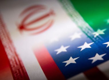 Iran's and U.S.' flags are seen printed on paper in this illustration taken January 27, 2022. REUTERS