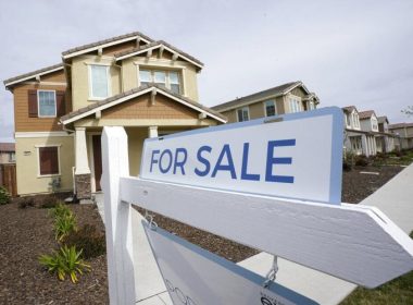 A "for sale" sign is posted in front of a home in Sacramento, Calif., March 3, 2022. Rich Pedroncelli / AP Photo