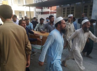 People shift coffins outside a hospital following a blast targeting a gathering of Islamic political party Jamiat Ulma-e-Islam (JUI-F) in Bajaur, Pakistan, on Sunday. Photo by Hanifullah Khan/EPA-EFE