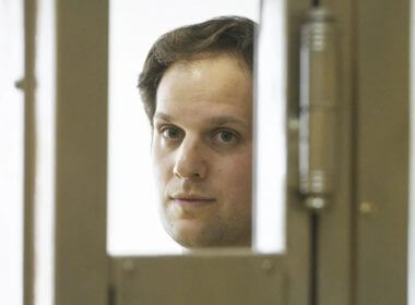 Wall Street Journal reporter Evan Gershkovich stands in a glass cage in a courtroom at the Moscow City Court in Moscow, Russia, Thursday, June 22, 2023. (AP Photo/Dmitry Serebryakov)