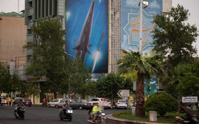 A giant image of Fattah, Iran's first-ever hypersonic missile, hangs on a wall of a government building in Palestine square in downtown Tehran, June 7, 2023. (Morteza Nikoubazl/NurPhoto via Getty Images)