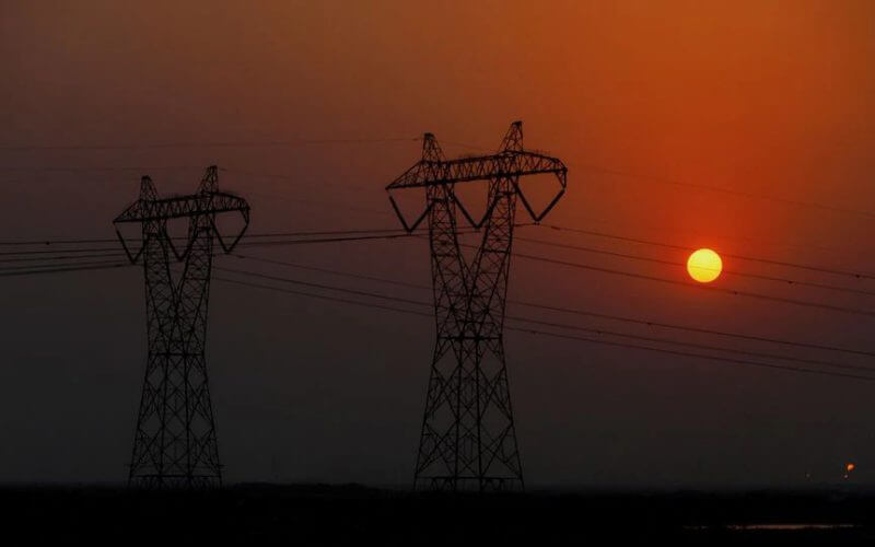 Power poles and power lines are pictured in Basra, Iraq August 20, 2021. REUTERS