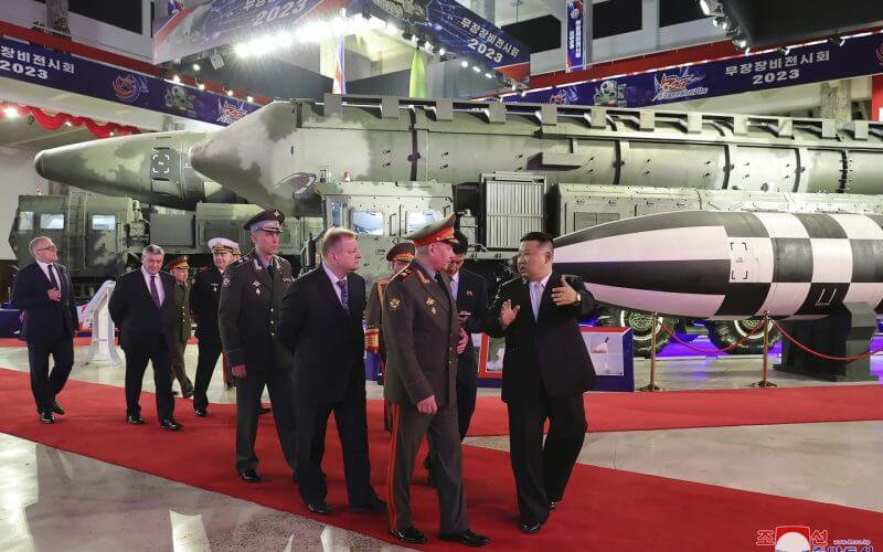 North Korean leader Kim Jong Un, right, with Russian delegation led by its Defense Minister Sergei Shoigu visits an arms exhibition Wednesday in Pyongyang, North Korea, on the occasion of the 70th anniversary of the armistice that halted fighting in the 1950-53 Korean War. (Korean Central News Agency/Korea News Service via AP)