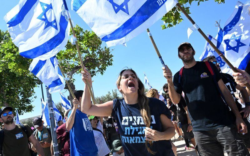 Israeli protesters hold Israeli flags and chant for democracy at a demonstration against Prime Minister Benjamin Netanyahu's judicial overhaul, outside the Supreme Court in Jerusalem, on Tuesday. Photo by Debbie Hill/UPI