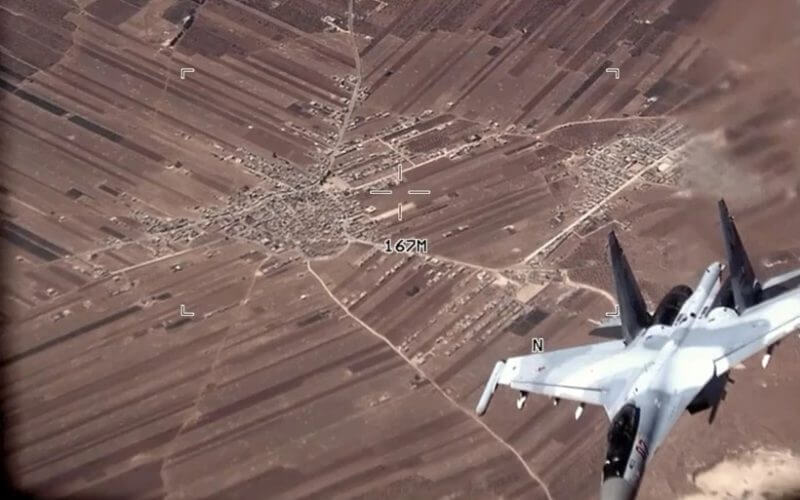 In this image from video released by the U.S. Air Force, a Russian SU-35 flies near a U.S. Air Force MQ-9 Reaper drone on Wednesday, July 5, 2023, over Syria (U.S. Air Force via AP)