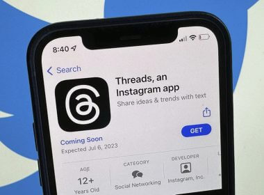 The announcement of the social media app 'Threads' is displayed in Apple's US App Store seen on the screen of a smartphone in Berlin, Germany, Tuesday, July 4, 2023. (Christoph Dernbach/dpa via AP)
