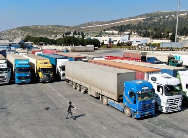 Trucks carrying aid from UN World Food Programme (WFP), following a deadly earthquake, are parked at Bab al-Hawa crossing, Syria February 20, 2023. REUTERS