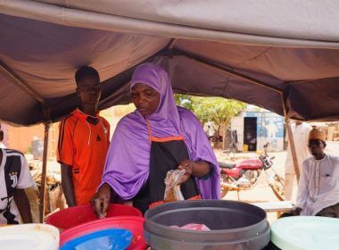 A woman prepares food in Niamey, Niger, Saturday, July 29, 2023. (AP Photo/Sam Mednick)