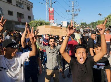 Palestinian demonstrators chant slogans during a protest against the territory's chronic power outages and difficult living conditions along the streets of Khan Younis, southern Gaza Strip, Sunday, July 30, 2023. (AP Photo)