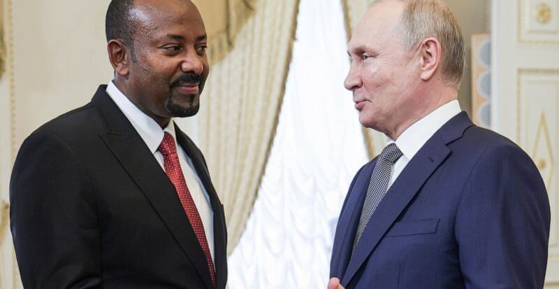 Russian President Vladimir Putin, right, and Ethiopian Prime Minister Abiy Ahmed shake hands during their meeting on the eve of the Russia Africa Summit in St. Petersburg, Russia, Wednesday, July 26, 2023. (TASS News Agency Host Pool Photo via AP, File)