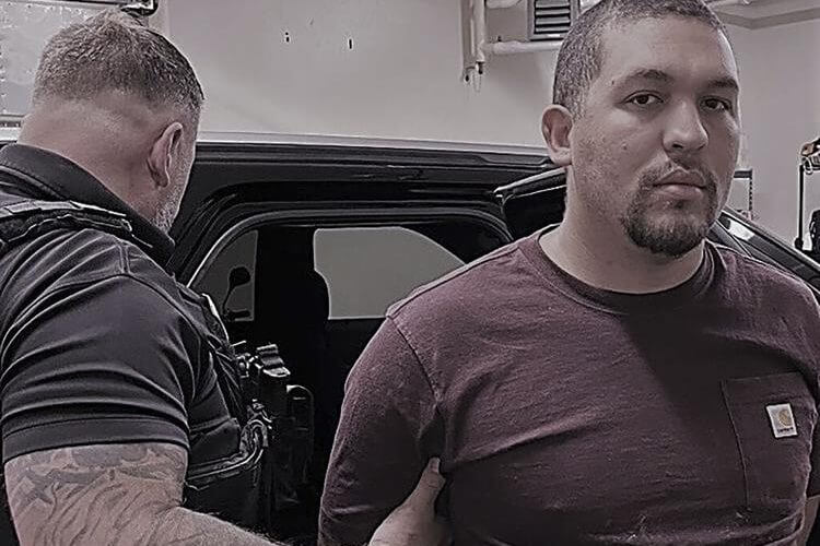 This image provided by U.S. Immigration and Customs Enforcement (ICE) shows former Brazilian military police officer Antonio Jose De Abreu Vidal Filho, right. The former military police officer who was convicted of multiple murders and sentenced to more than 200 years in prison for his part in a 2015 Brazilian massacre was arrested Monday, Aug. 14, 2023, in Rye, N.H, immigration officials said. (U.S. Immigration and Customs Enforcement via AP)