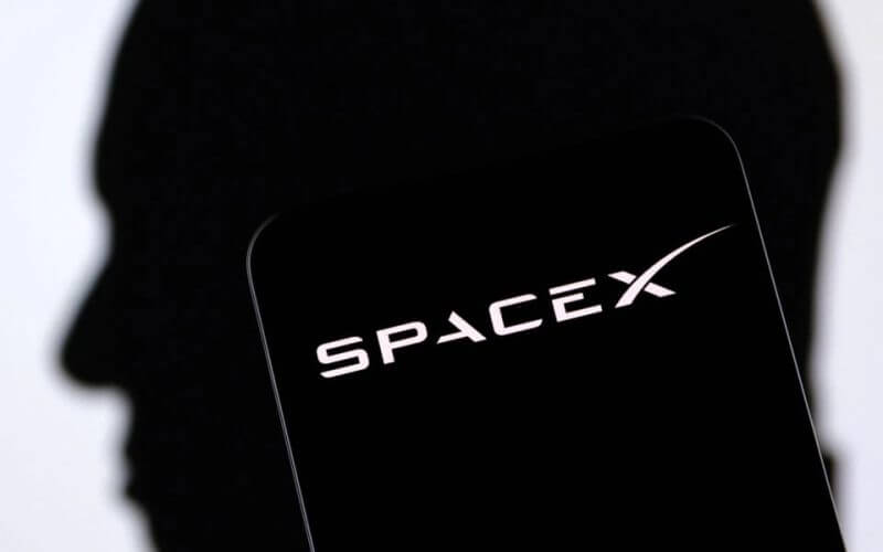 SpaceX logo and Elon Musk silhouette are seen in this illustration taken, December 19, 2022. REUTERS