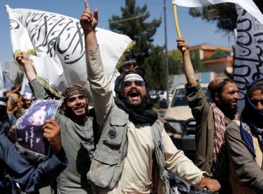 Taliban members rejoice on the second anniversary of the fall of Kabul on a street near the US embassy in Kabul, Afghanistan, August 15. REUTERS