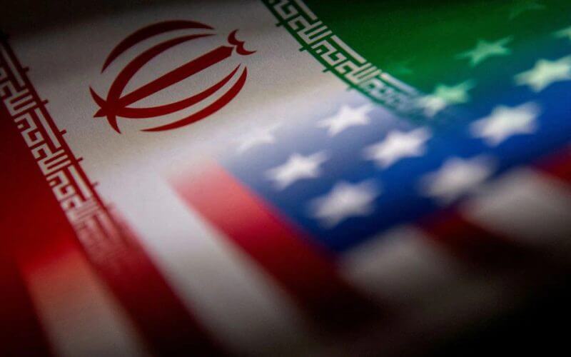 Iran's and U.S.'s flags are seen printed on paper in this illustration taken January 27, 2022. REUTERS