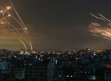 The Israeli Iron Dome missile defense system (L) intercepts rockets (R) fired by the Hamas movement toward southern Israel from Beit Lahia in the northern Gaza Strip as seen in the sky above the Gaza Strip overnight on May 14, 2021. (ANAS BABA/AFP via Getty Images)