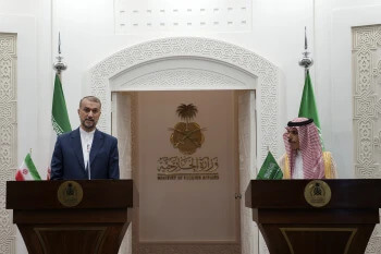 In this picture released by the Iranian Foreign Ministry, Iran's Foreign Minister Hossein Amirabdollahian, left, speaks during a joint news briefing with his Saudi Arabian counterpart Prince Faisal bin Farhan Al Saud in Riyadh, Saudi Arabia, Thursday, Aug. 17, 2023. (Iranian Foreign Ministry via AP)