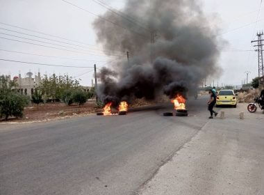Tires burn as demonstrators protest against the Syrian government decision on increasing the prices of fuels in Sweida, Syria, August 17, 2023. Sweida 24/Handout via REUTERS