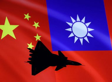 Airplane is seen in front of Chinese and Taiwanese flags in this illustration, August 6, 2022. REUTERS
