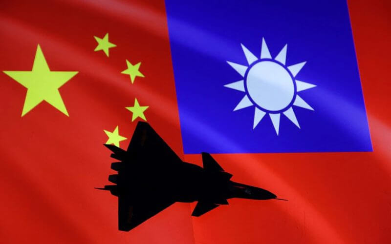Airplane is seen in front of Chinese and Taiwanese flags in this illustration, August 6, 2022. REUTERS