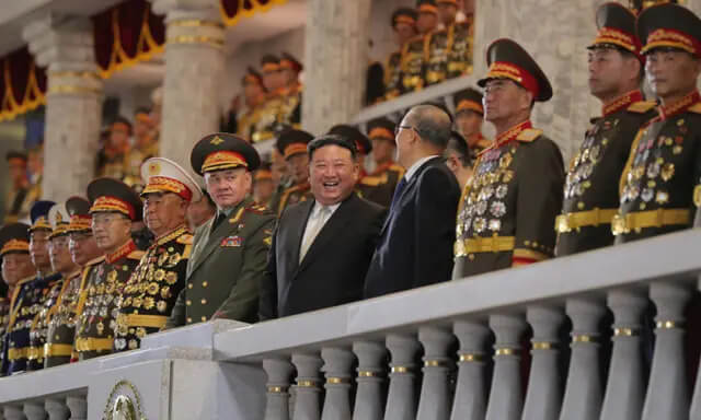 North Korean leader Kim Jong Un, Chinese Communist Party politburo member Li Hongzhong, and Russian Defense Minister Sergei Shoigu attend a military parade to commemorate the 70th anniversary of the Korean War armistice in Pyongyang, North Korea, on July 27, 2023. (KCNA via Reuters)
