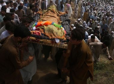 Relatives and mourners carry the casket of a victim who was killed in Sunday's suicide bomber attack in the Bajur district of Khyber Pakhtunkhwa, Pakistan, Monday, July 31, 2023. (AP Photo/Mohammad Sajjad)