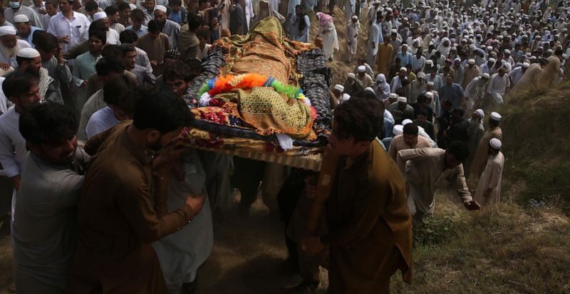 Relatives and mourners carry the casket of a victim who was killed in Sunday's suicide bomber attack in the Bajur district of Khyber Pakhtunkhwa, Pakistan, Monday, July 31, 2023. (AP Photo/Mohammad Sajjad)
