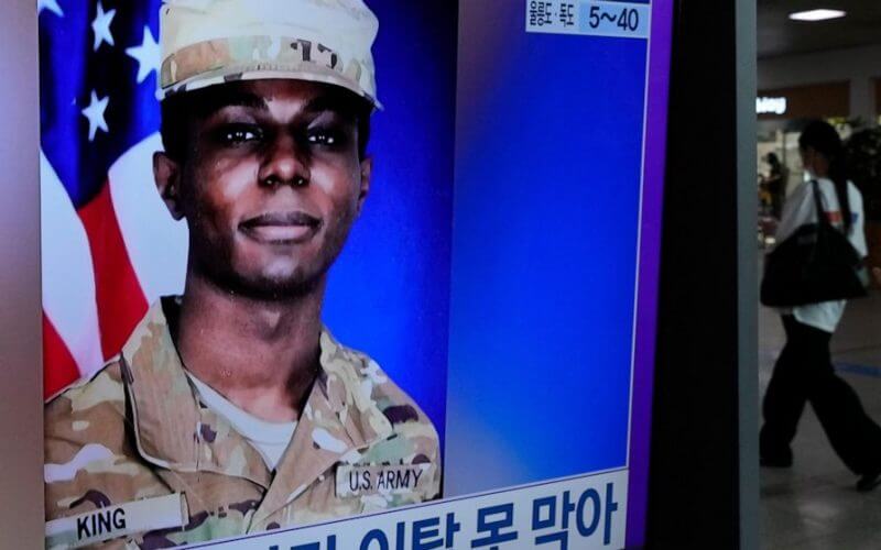 A TV screen shows a file image of American soldier Travis King during a news program at the Seoul Railway Station in Seoul, South Korea, Wednesday, Aug. 16, 2023. (AP Photo/Ahn Young-joon)