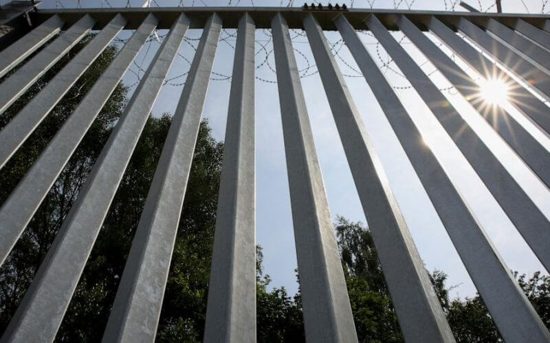 A metal wall on the border between Poland and Belarus, near Kuznice, Poland, on June 30, 2022. (AP Photo/Michal Dyjuk, File)