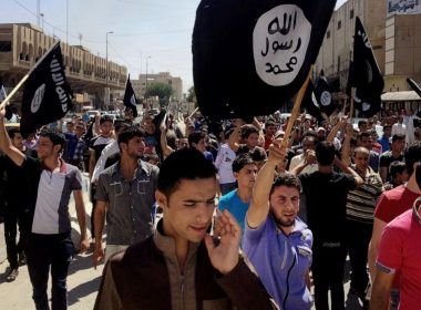 Demonstrators chant pro-Islamic State group slogans as they carry the group's flags in front of the provincial government headquarters in Mosul, Iraq, June 16, 2014. (AP Photo, File)