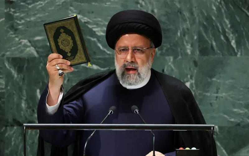 Iranian President Ebrahim Raisi holds up the Quran as he addresses the 78th session of the U.N. General Assembly in New York City on Sept. 19, 2023. (Reuters / Mike Segar)