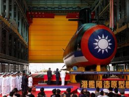 A bottle is broken against the hull of Haikun, Taiwan's first domestically built submarine, as President Tsai Ing-wen attends the submarine's launching ceremony in Kaohsiung, Taiwan September 28, 2023. REUTERS