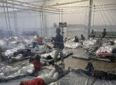 This March 20, 2021, photo provided by the Office of Rep. Henry Cuellar, D-Texas, shows detainees in a Customs and Border Protection (CBP) temporary overflow facility in Donna, Texas. President Joe Biden's administration faces mounting criticism for refusing to allow outside observers into facilities where it is detaining thousands of immigrant children. Photo courtesy of the Office of Rep. Henry Cuellar via AP