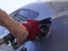 A customer pumps gas at an Exxon gas station, Tuesday, May 10, 2022, in Miami. Marta Lavandier AP
