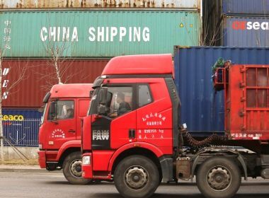 Pictured are drivers transporting shipping containers from the port city of Tianjin, one of the busiest commercial ports in the world. Photo by Stephen Shaver/UPI