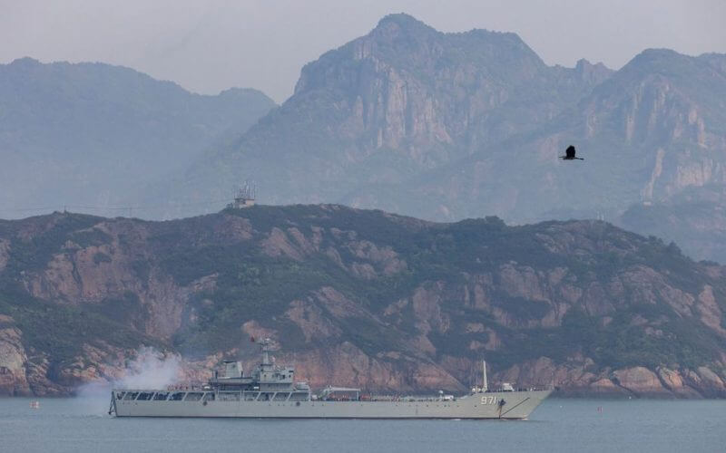 A Chinese warship fires during a military drill off the Chinese coast near Fuzhou, Fujian Province, across from the Taiwan-controlled Matsu Islands, China, April 11, 2023. REUTERS